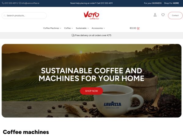 Screenshot of Vero Coffee Co's online store homepage. The top navigation includes contact info, a search bar, and menu links. A banner below features a scenic landscape with text: "Sustainable Coffee and Machines for your Home," and a Lavazza coffee cup.